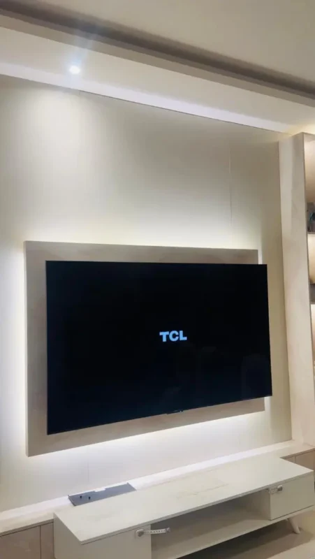 TV installation on wood panel wall in Riyadh